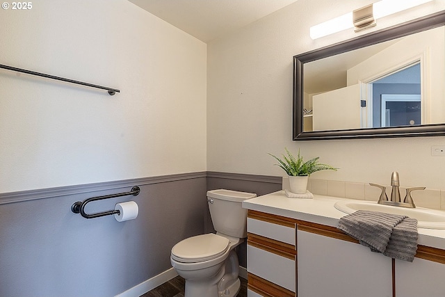 10522 SE Liebe St, Portland, OR 97266 - half bathroom with toilet, vanity, and wood finished floors