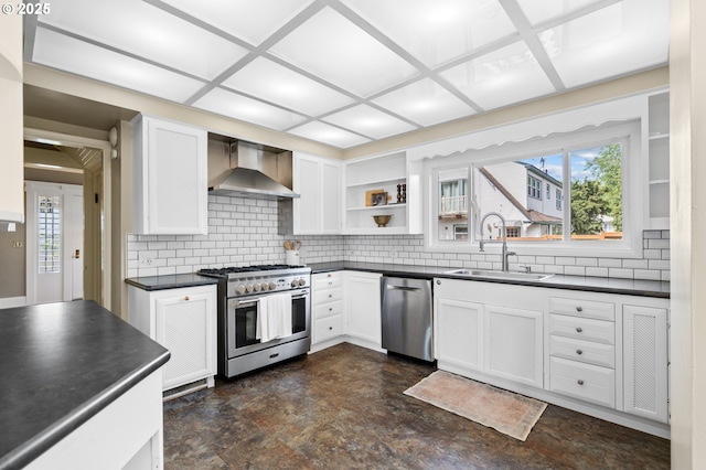 1001 NW Despain Ave, Pendleton, OR 97801 - kitchen with stainless steel appliances, wall chimney range hood, dark countertops, and a sink