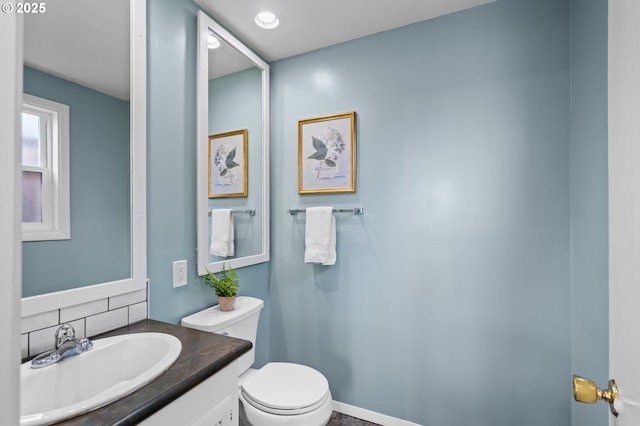 1001 NW Despain Ave, Pendleton, OR 97801 - bathroom with toilet, vanity, and tasteful backsplash