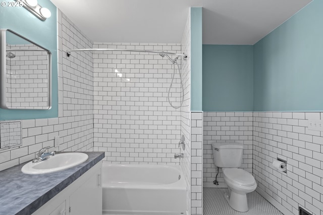 1001 NW Despain Ave, Pendleton, OR 97801 - full bath featuring tile walls, vanity, shower / bath combination, toilet, and tile patterned floors