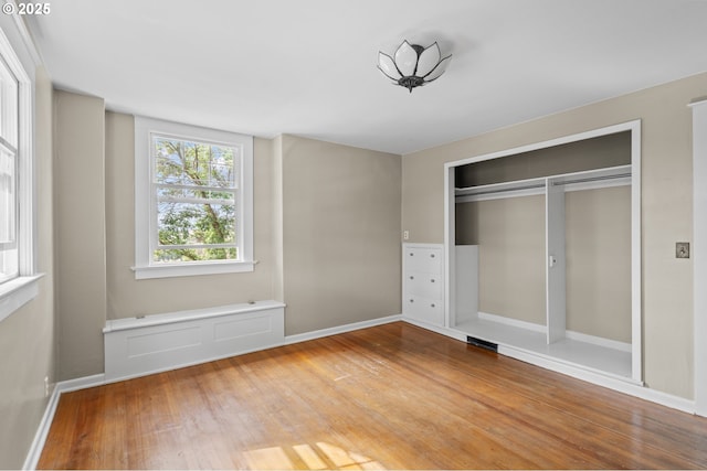 1001 NW Despain Ave, Pendleton, OR 97801 - unfurnished bedroom featuring wood finished floors, a closet, and baseboards