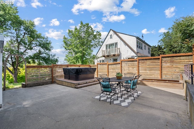 1001 NW Despain Ave, Pendleton, OR 97801 - fenced backyard featuring a hot tub, a patio, and outdoor dining space
