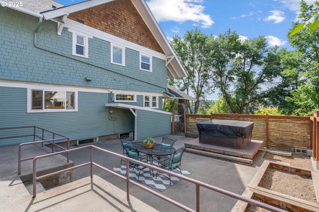 1001 NW Despain Ave, Pendleton, OR 97801 - rear view of house with a hot tub, a patio, and a fenced backyard
