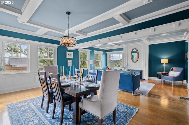 1001 NW Despain Ave, Pendleton, OR 97801 - dining room featuring a chandelier, coffered ceiling, a decorative wall, ornamental molding, and beam ceiling
