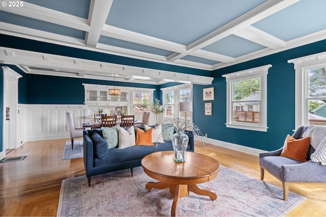1001 NW Despain Ave, Pendleton, OR 97801 - living room with beamed ceiling, coffered ceiling, baseboards, wood finished floors, and ornamental molding