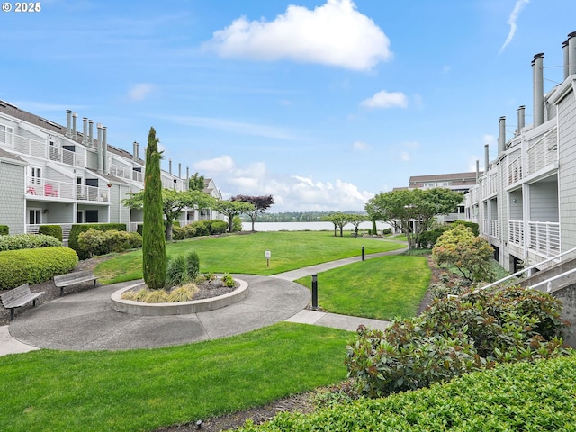 view of property's community featuring a yard