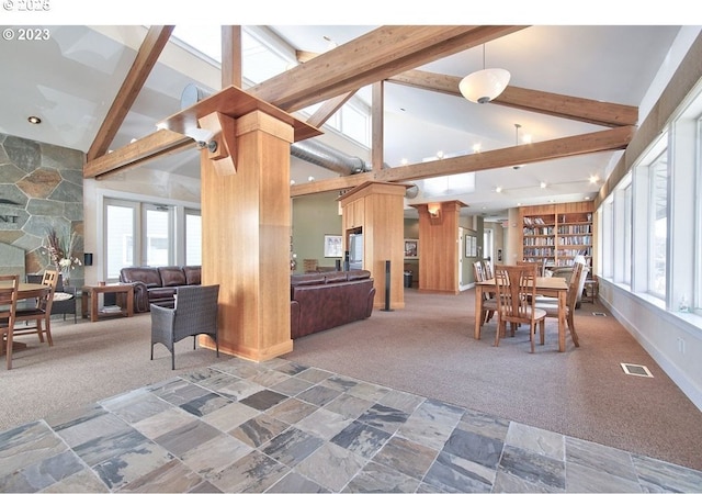 carpeted dining area with high vaulted ceiling, visible vents, and beamed ceiling