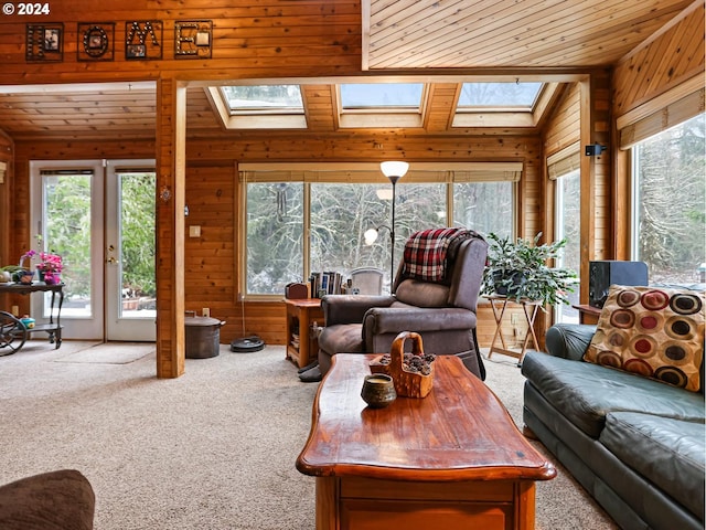 24940 E Tillicum St, Welches, OR 97067 - living room with a skylight, carpet floors, healthy amount of natural light, wood walls, and wooden ceiling