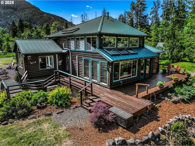 24940 E Tillicum St, Welches, OR 97067 - rear view of property featuring metal roof, a deck with mountain view, and log veneer siding