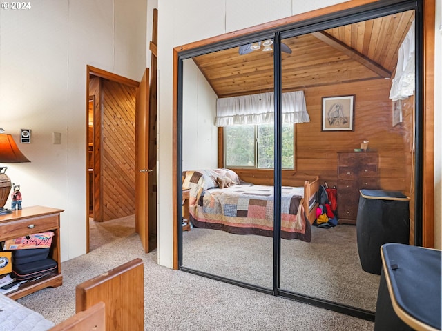 24940 E Tillicum St, Welches, OR 97067 - carpeted bedroom featuring wooden walls, wood ceiling, a closet, and vaulted ceiling