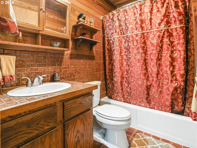 24940 E Tillicum St, Welches, OR 97067 - full bathroom featuring toilet, vanity, shower / bath combo with shower curtain, tasteful backsplash, and tile patterned floors