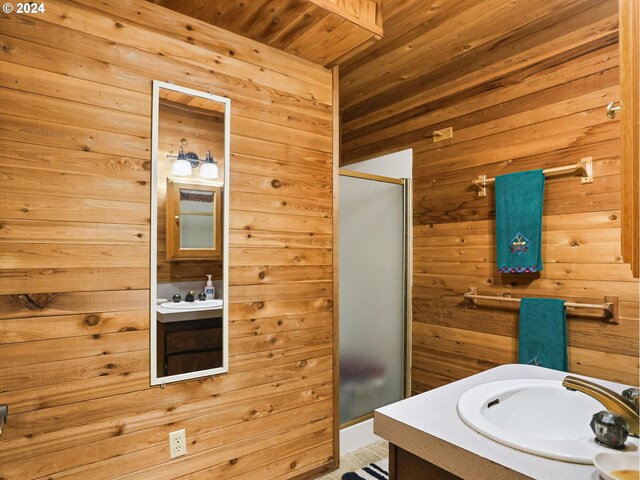 24940 E Tillicum St, Welches, OR 97067 - bathroom featuring wood ceiling, vanity, wood walls, and a stall shower