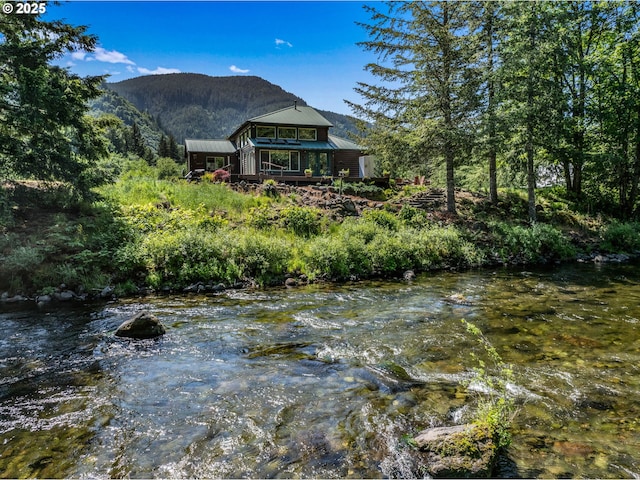 24940 E Tillicum St, Welches, OR 97067 - water view with mountains and a forest