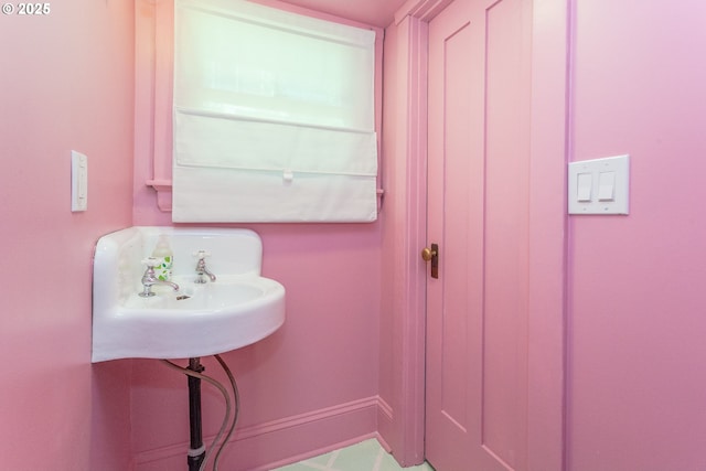 bathroom with baseboards