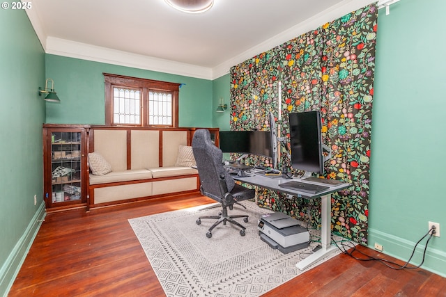 home office featuring wood finished floors, crown molding, and baseboards