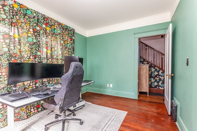 home office with wood finished floors, baseboards, and crown molding