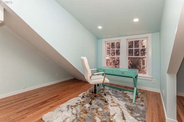 office space with wood finished floors, recessed lighting, and baseboards