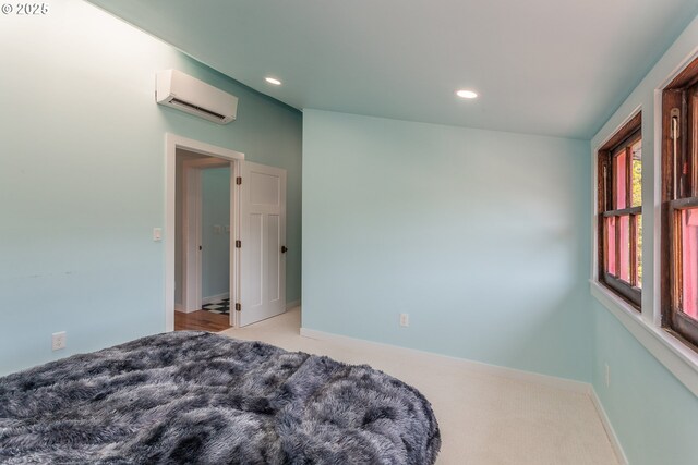 carpeted bedroom featuring an AC wall unit, recessed lighting, and baseboards