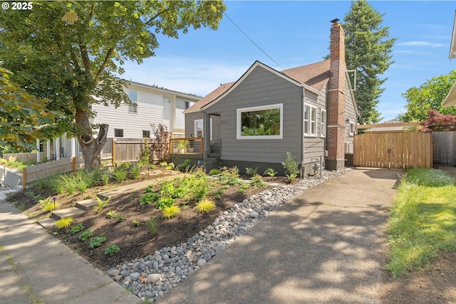 6232 NE 6th Ave, Portland, OR 97211 - view of front of house with a chimney and a deck
