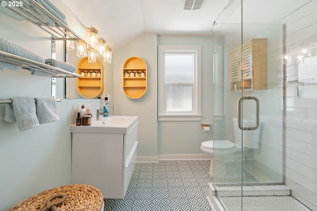 6232 NE 6th Ave, Portland, OR 97211 - full bathroom featuring a shower stall, vanity, toilet, lofted ceiling, and baseboards