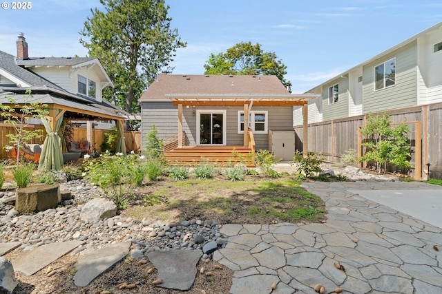 6232 NE 6th Ave, Portland, OR 97211 - back of property featuring a gazebo, a fenced backyard, a patio area, and a pergola