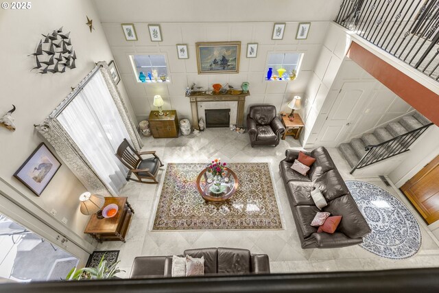 living room featuring a fireplace and tile patterned flooring