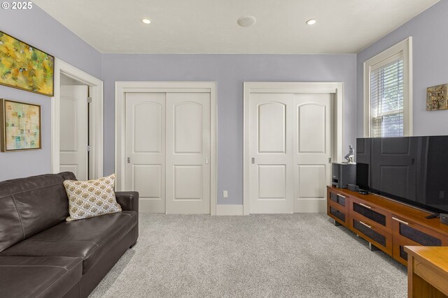 carpeted living room with recessed lighting