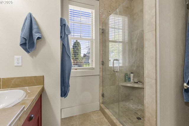 bathroom with crown molding, double vanity, a chandelier, and tile patterned floors