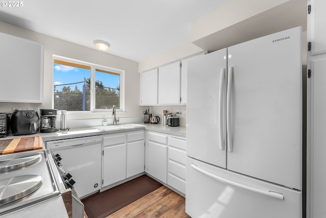 1371 NW Jefferson St, Roseburg, OR 97471 - kitchen with white appliances, a sink, light countertops, and white cabinets