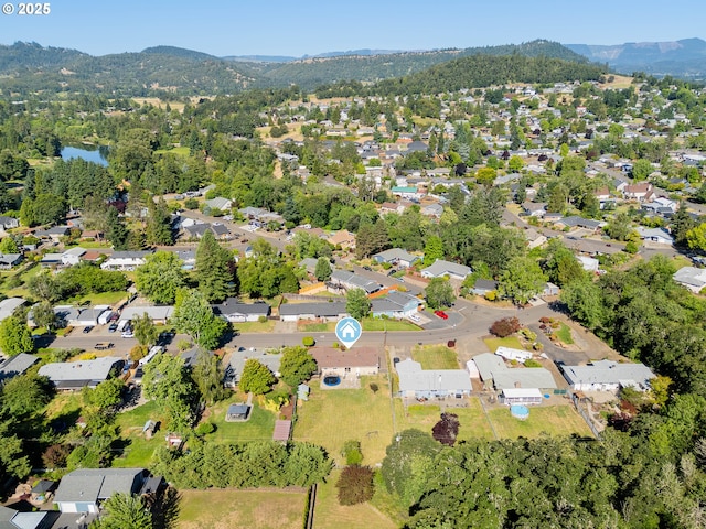 1371 NW Jefferson St, Roseburg, OR 97471 - aerial view of property and surrounding area featuring mountains and nearby suburban area
