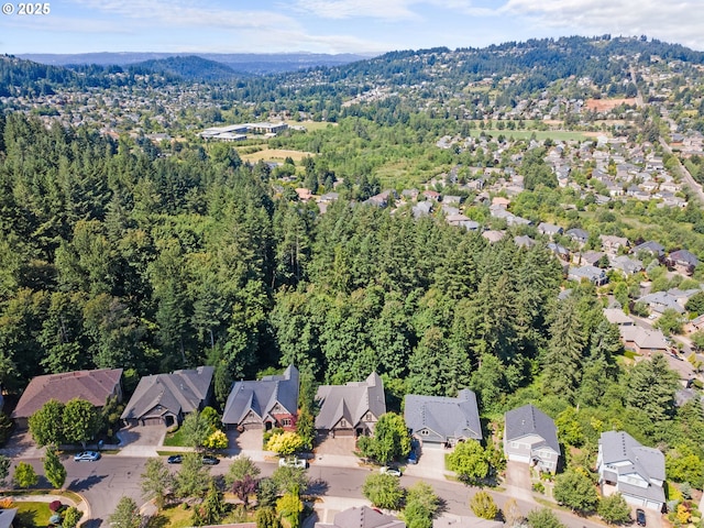 9641 SE Nicholas Dr, Happy Valley, OR 97086 - aerial view of property and surrounding area with nearby suburban area and a heavily wooded area