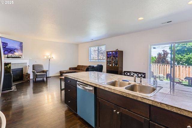 51276 SW Rembrandt Dr, Scappoose, OR 97056 - kitchen featuring dishwashing machine, dark brown cabinets, healthy amount of natural light, dark wood-style floors, and recessed lighting