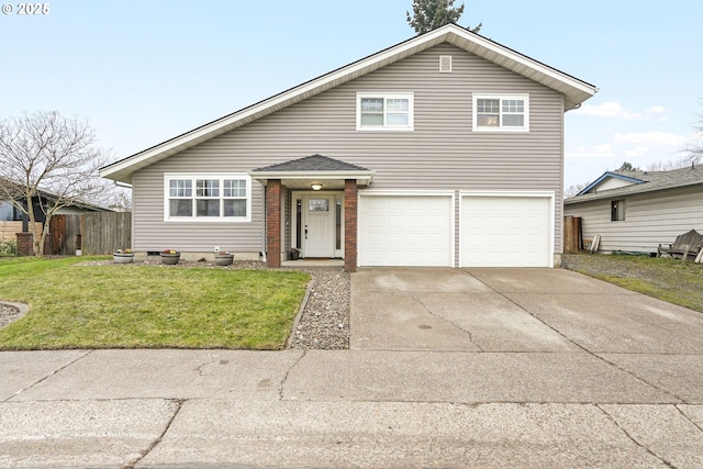 view of front of property featuring a front lawn and a garage