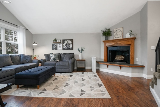 living room with lofted ceiling and wood-type flooring