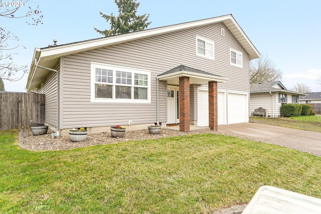 view of front of property featuring a garage and a front yard