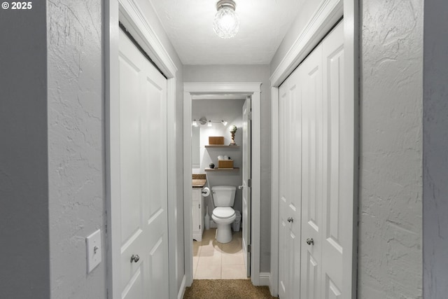 hallway featuring carpet floors