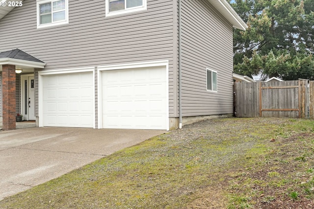 view of side of home with a garage