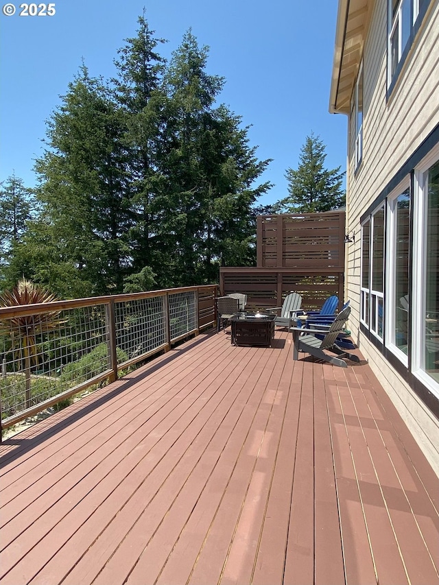 97661 Marina Heights Loop, Brookings, OR 97415 - wooden deck with a fire pit