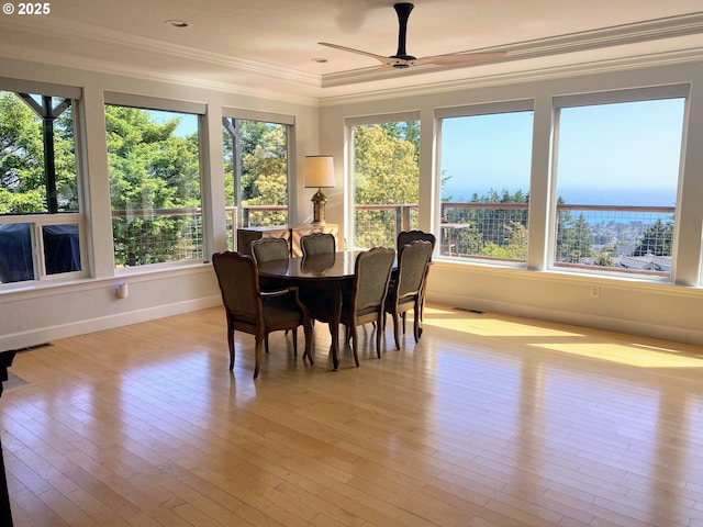 97661 Marina Heights Loop, Brookings, OR 97415 - dining room with ornamental molding, plenty of natural light, ceiling fan, and light wood-style floors