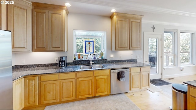 97661 Marina Heights Loop, Brookings, OR 97415 - kitchen with appliances with stainless steel finishes, dark stone countertops, light brown cabinetry, and recessed lighting