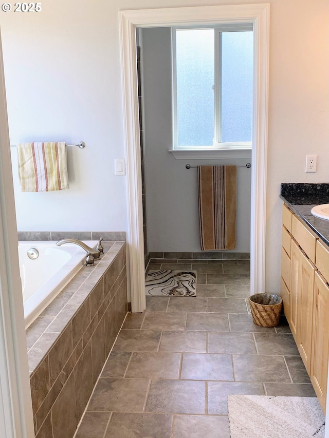97661 Marina Heights Loop, Brookings, OR 97415 - full bathroom featuring a bath, vanity, and stone finish floors