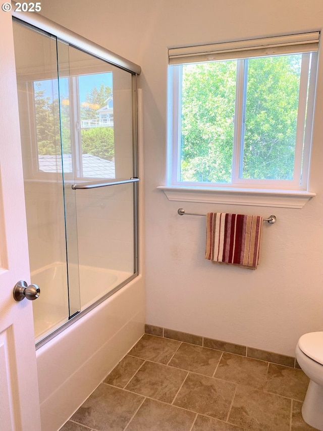 97661 Marina Heights Loop, Brookings, OR 97415 - bathroom featuring baseboards and enclosed tub / shower combo