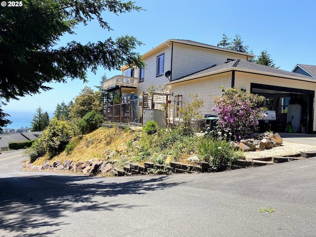 97661 Marina Heights Loop, Brookings, OR 97415 - view of side of home featuring a garage