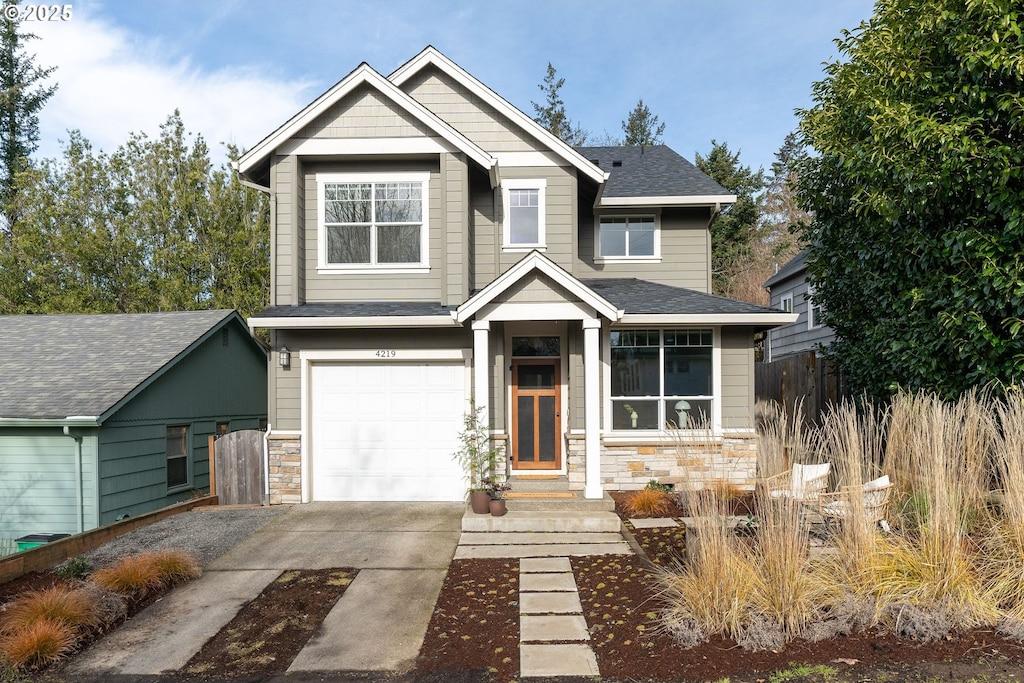 craftsman inspired home with a garage