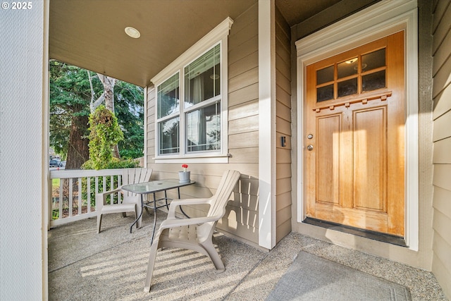 property entrance featuring covered porch