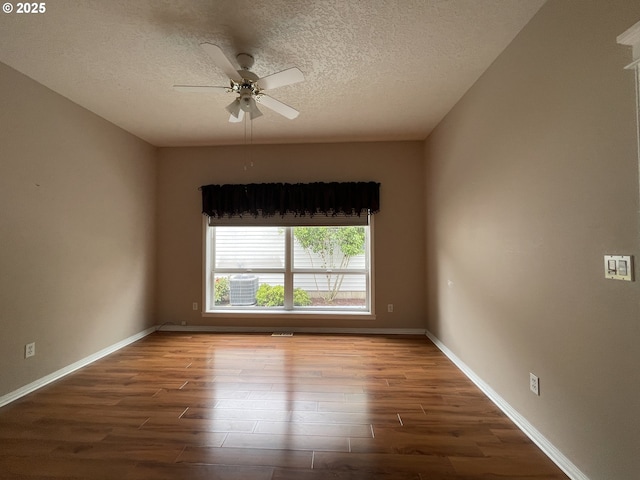 15732 NE Russell St, Portland, OR 97230 - spare room with wood finished floors, a ceiling fan, a textured ceiling, and baseboards