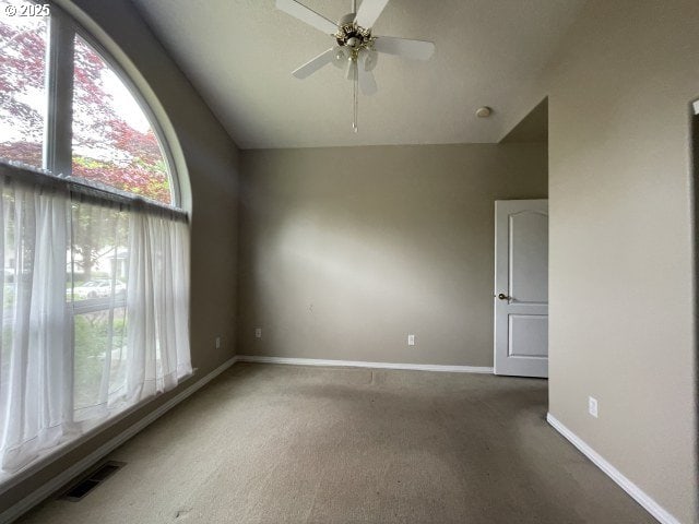 15732 NE Russell St, Portland, OR 97230 - carpeted empty room with lofted ceiling, ceiling fan, and baseboards