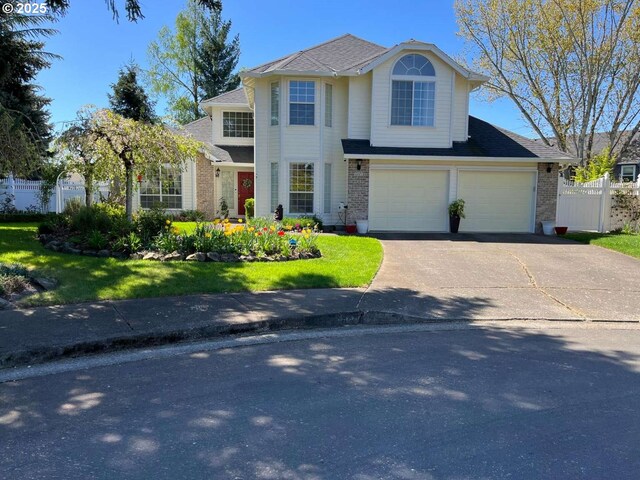 3553 NW 163rd Ct, Beaverton, OR 97006 - traditional-style house featuring brick siding, driveway, a garage, and a shingled roof