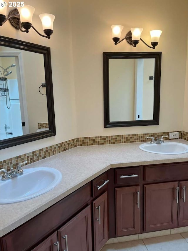 3553 NW 163rd Ct, Beaverton, OR 97006 - bathroom with double vanity, backsplash, and tile patterned flooring