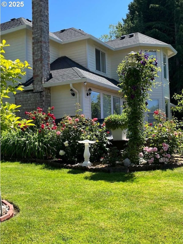 3553 NW 163rd Ct, Beaverton, OR 97006 - view of front facade featuring a front lawn, a shingled roof, and a chimney